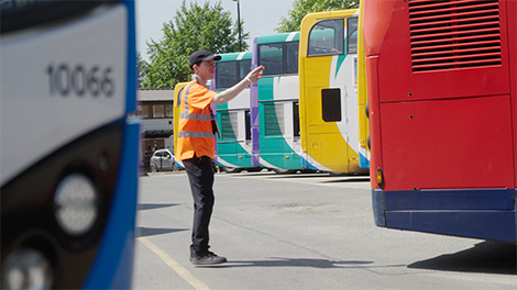 Stagecoach employee directing buses