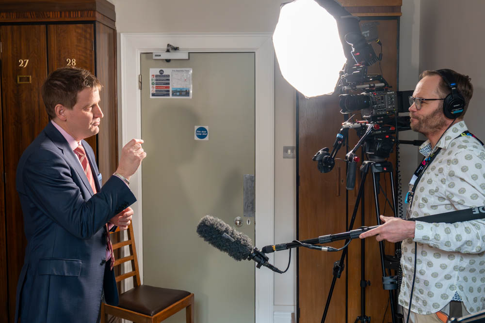 Tom Chown filming Mike Martin MP under studio lighting during a professional video shoot