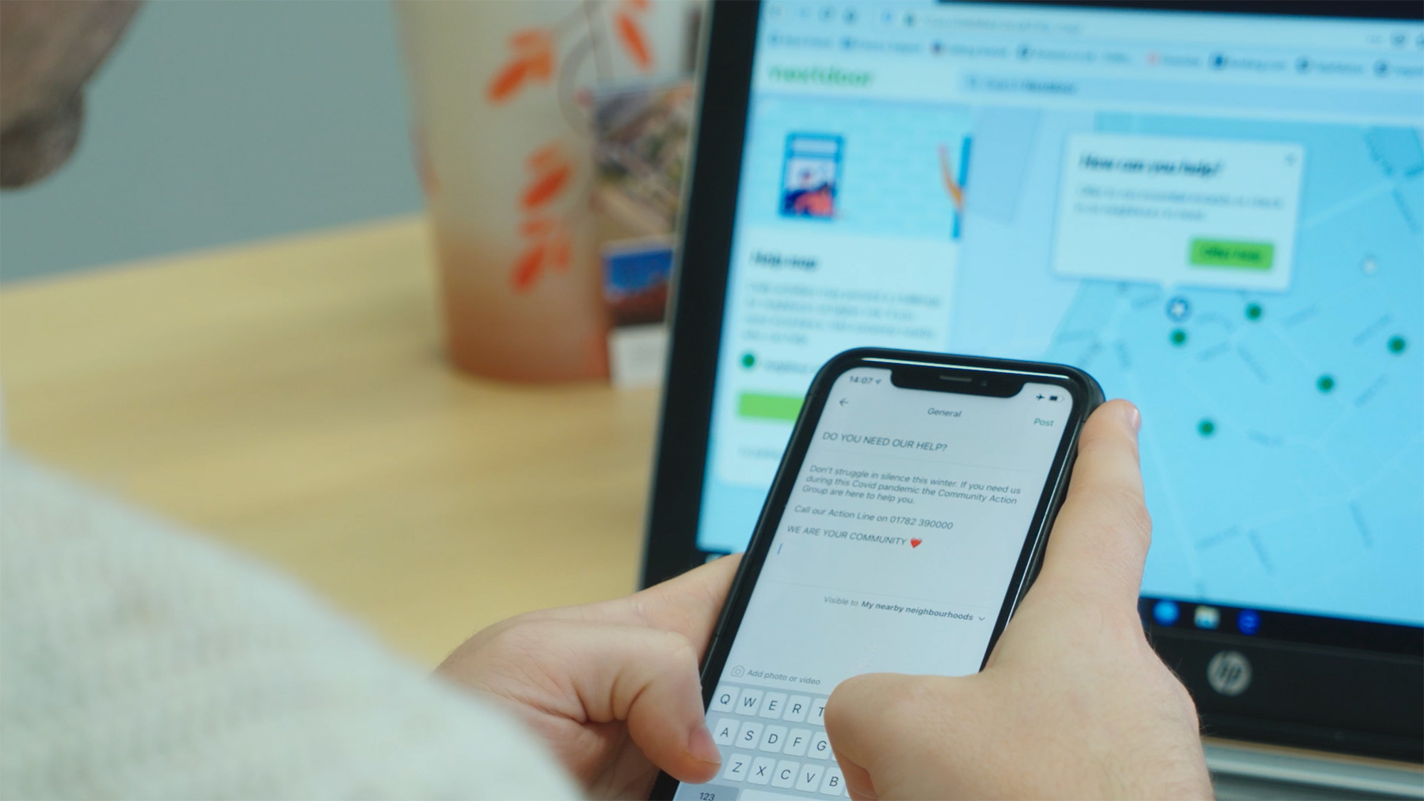 Person using a mobile phone and typing a message on Nextdoor phone