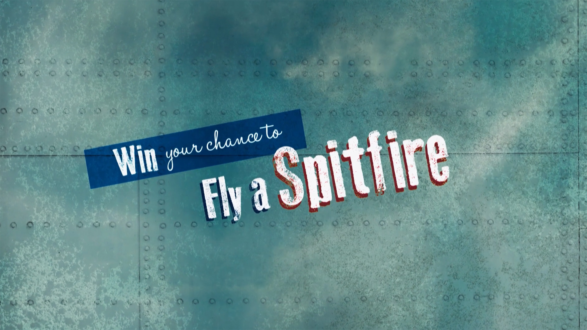 Promotional graphic reading ‘Win your chance to fly a Spitfire’ on a metallic aircraft‑style background